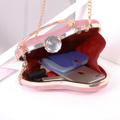 Heart-shaped hand holding chain bag