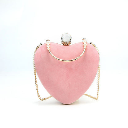 Heart-shaped hand holding chain bag