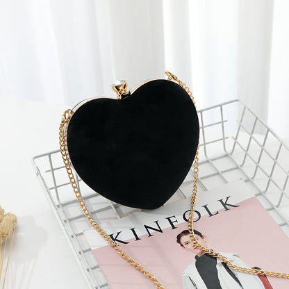 Heart-shaped hand holding chain bag