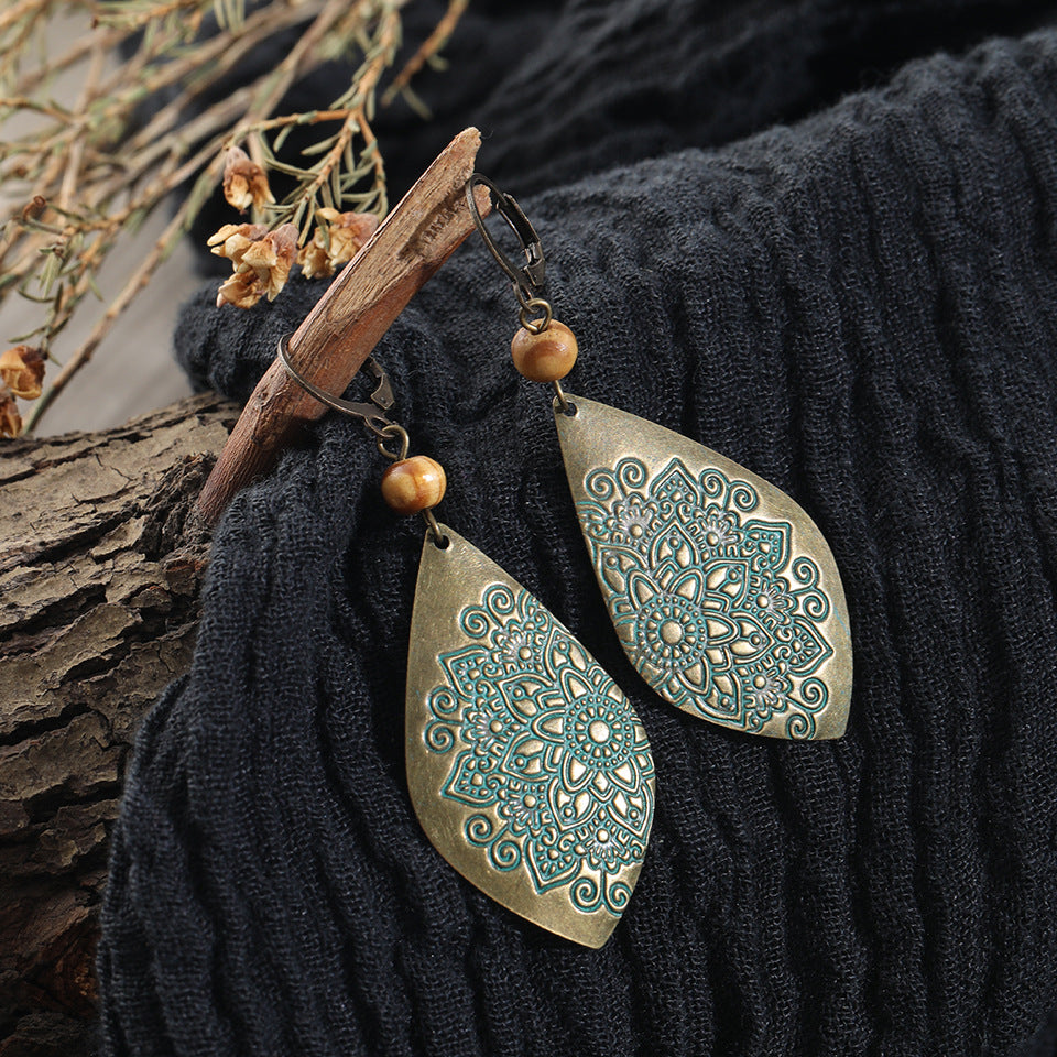 Boucles d'oreilles motif sculpté style ethnique
