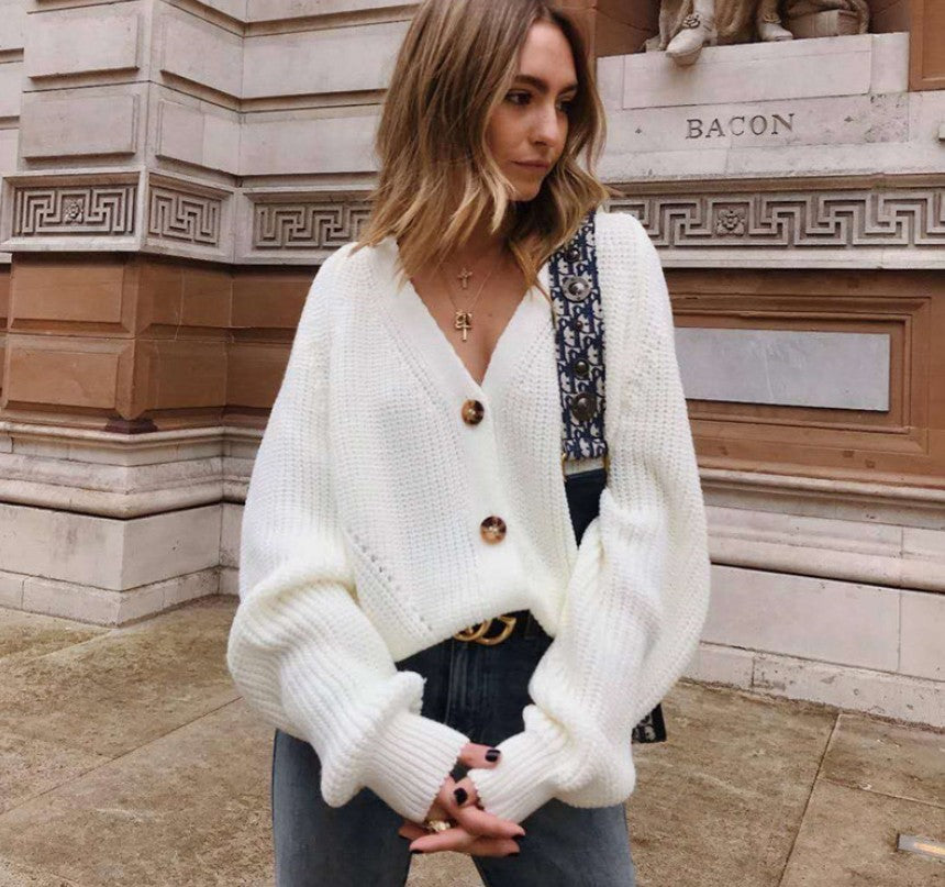 suéter de mujer de color liso con cuello en V y botones