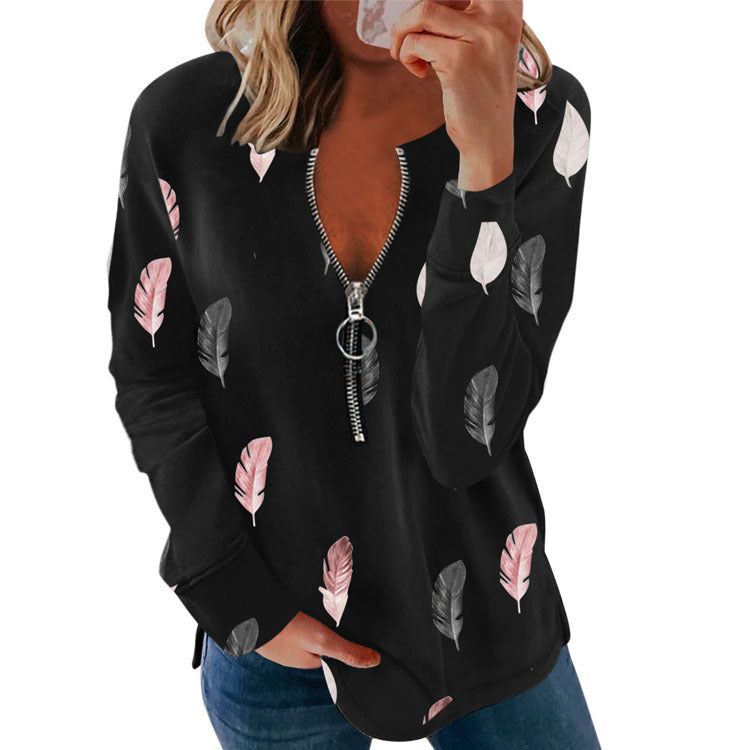 Camiseta holgada de manga larga con estampado de plumas y cremallera con cuello en V para mujer