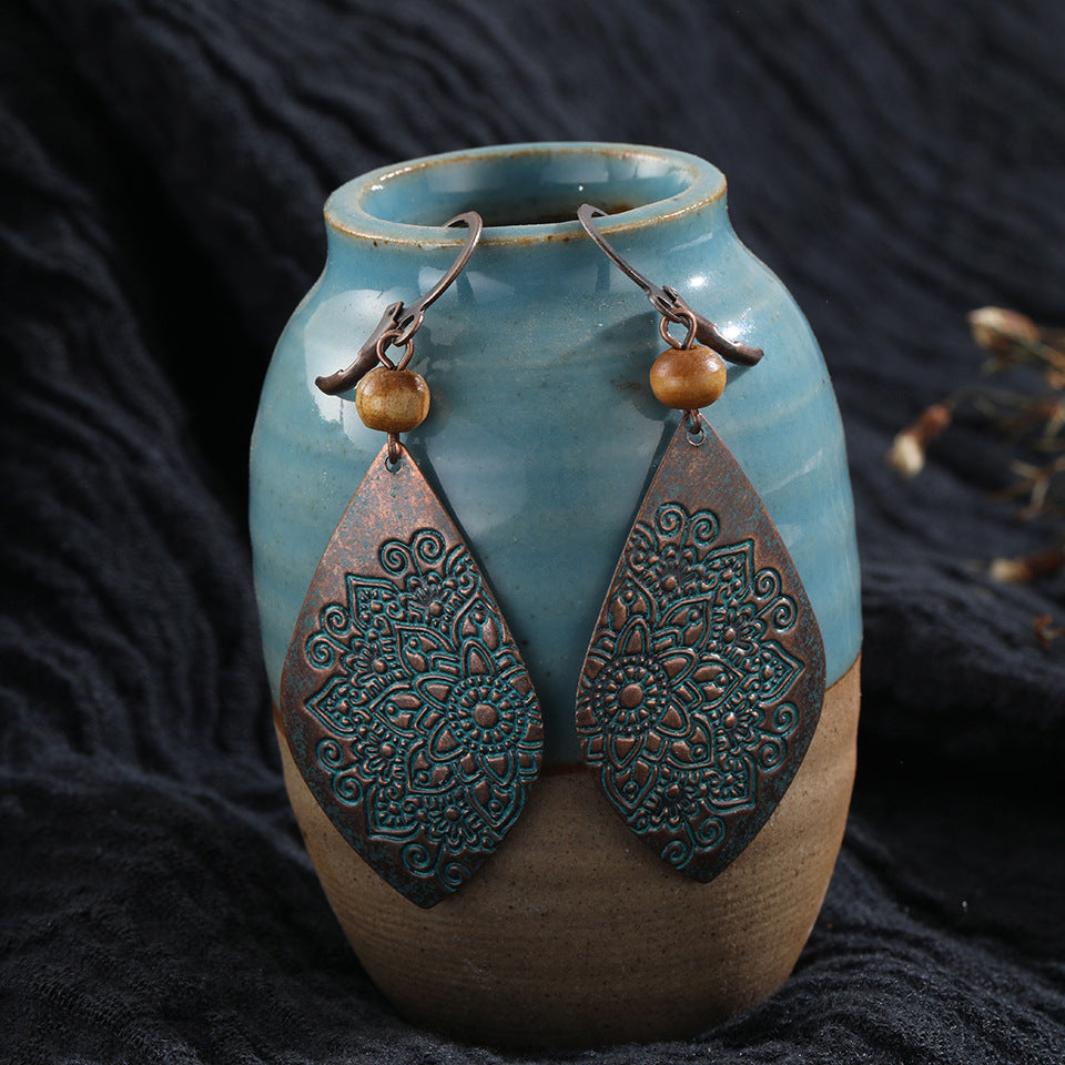 Boucles d'oreilles motif sculpté style ethnique
