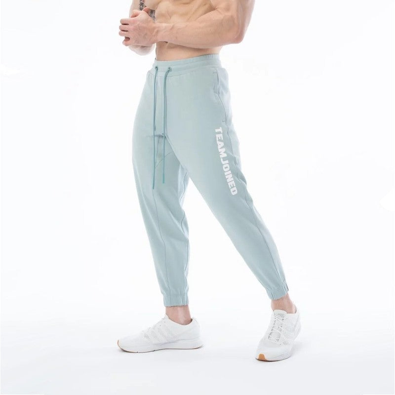 Pantalones de chándal deportivos sueltos de algodón para entrenamiento físico para hombres