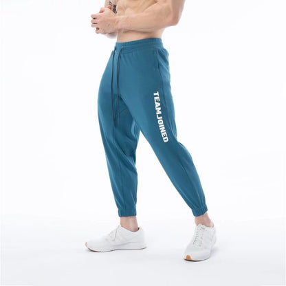 Pantalones de chándal deportivos sueltos de algodón para entrenamiento físico para hombres