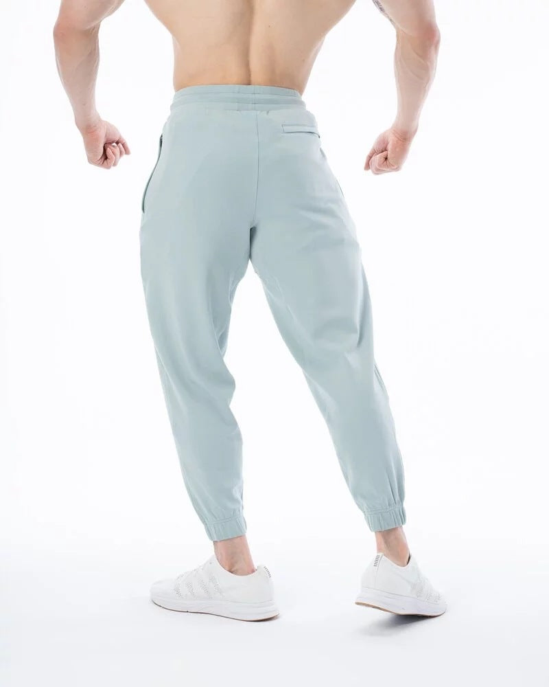 Pantalones de chándal deportivos sueltos de algodón para entrenamiento físico para hombres