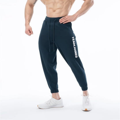 Pantalones de chándal deportivos sueltos de algodón para entrenamiento físico para hombres